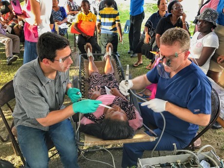guyana-dr-simpson-and-aaron-with-patient-460x345