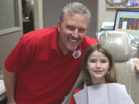 Pictured above is Dr. Dwight Simpson with Olivia, who was happy to be seen and get her teeth cleaned. 